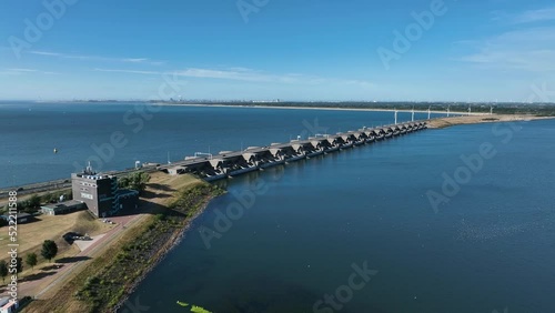 Wallpaper Mural Deltawerken tide water level control dam with spinning wind turbines; drone Torontodigital.ca