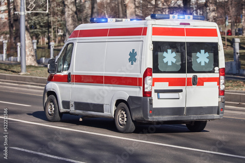 Wallpaper Mural Paramedic 911 ambulance car running fast through the big city. Torontodigital.ca