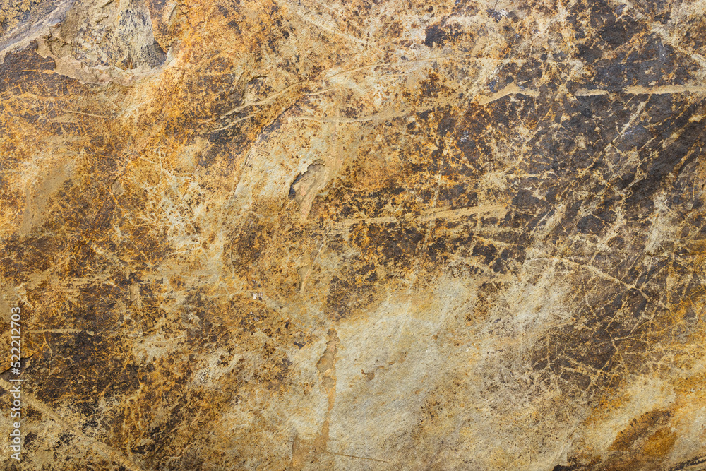 Natural stone background with golden veins. Granite slab stone, rustic matt texture