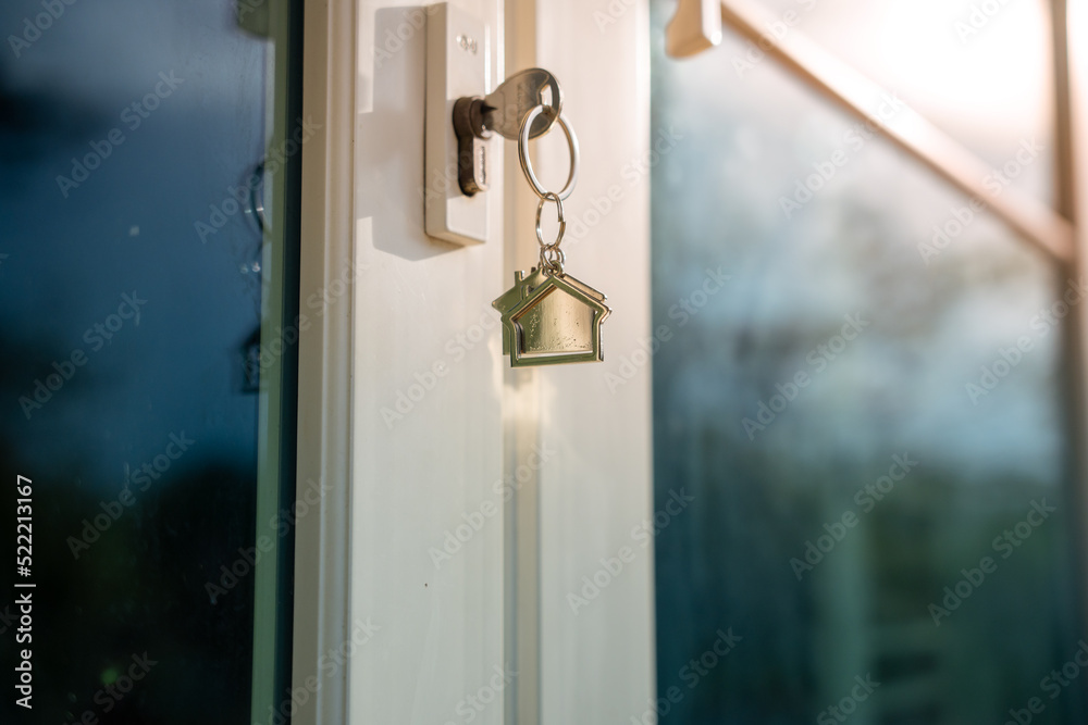 House doors with keys for new homes, new owners, buying and selling homes and real estate investments. Mortgage, rent, buy, sell, move home concept House doors with keys for new homes, new owners, buying and selling homes and real estate investments. Mortgage, rent, buy, sell, move home concept