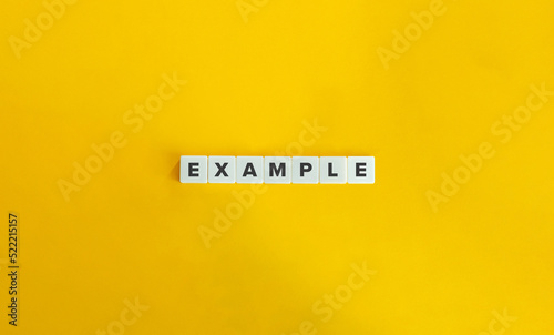 Example Word on Letter Tiles on Yellow Background. Minimal Aesthetics. photo