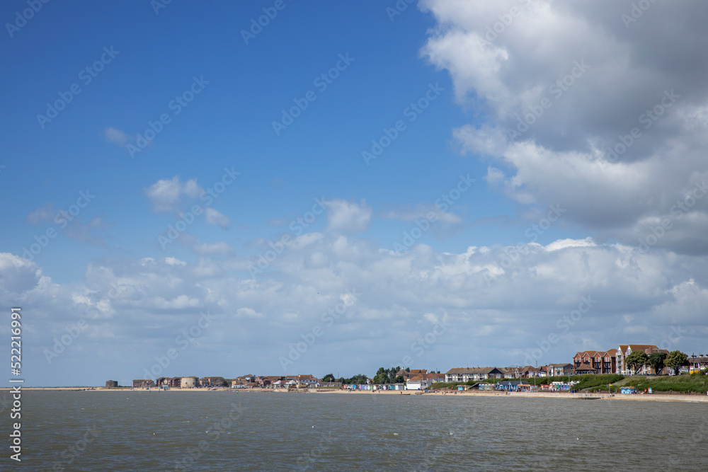 Clacton on sea. Essex. England. UK, Great Brittain. Seaside resort. Clouds and shoreline. Beach and sea. 