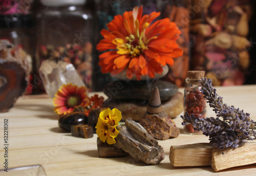 Flowers and Incense Cone With Palo Santo Sticks on Meditation Table