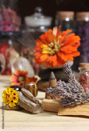 Flowers and Incense Cone With Palo Santo Sticks on Meditation Table