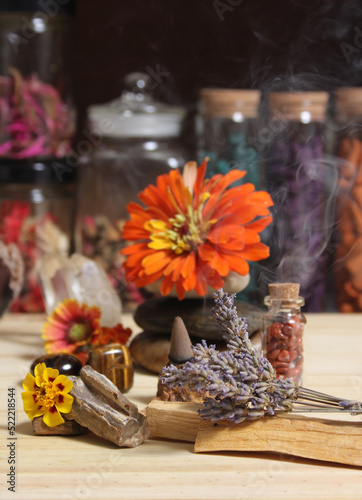 Flowers and Incense Cone With Palo Santo Sticks on Meditation Table