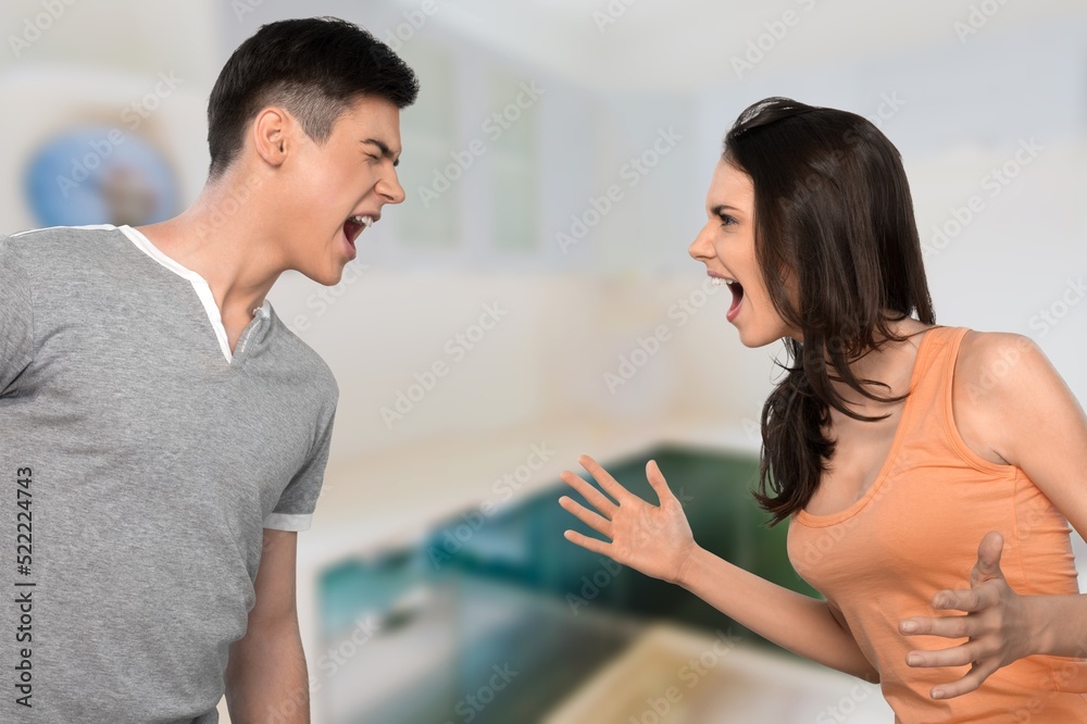 Relationship problems concept. Angry man arguing with his wife, husband and wife shouting at each other and gesturing Relationship problems concept. Angry man arguing with his wife, husband and wife shouting at each other and gesturing