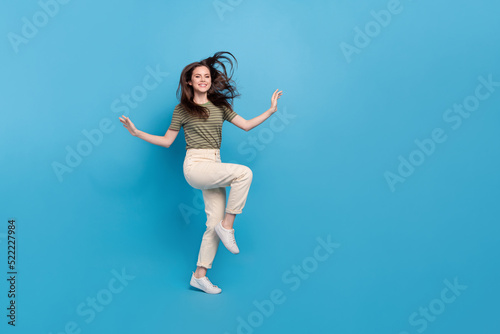 Fototapeta Naklejka Na Ścianę i Meble -  Full body photo of funny millennial brunette lady dance wear casual cloth isolated on blue background