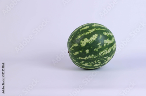 green watermelon on white background in studio. High quality photo