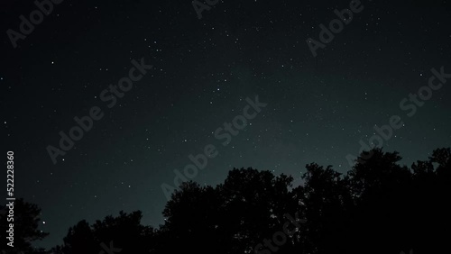 Timelapse of airplanes flying by and stars in the night sky