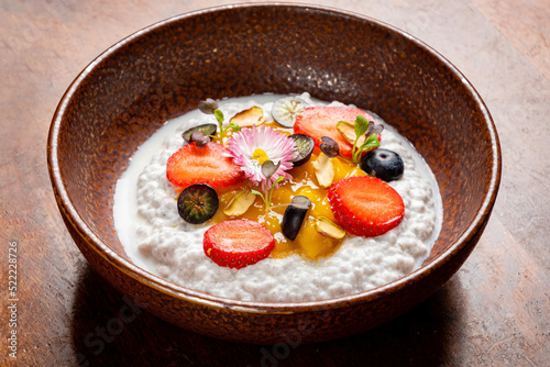 Rice pudding. french milk rice dessert with raspberries, blueberries, berries