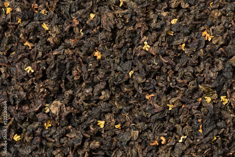 Gui Cha Osmanthus dried tea leaves close up full frame as background Gui Cha Osmanthus dried tea leaves close up full frame as background
