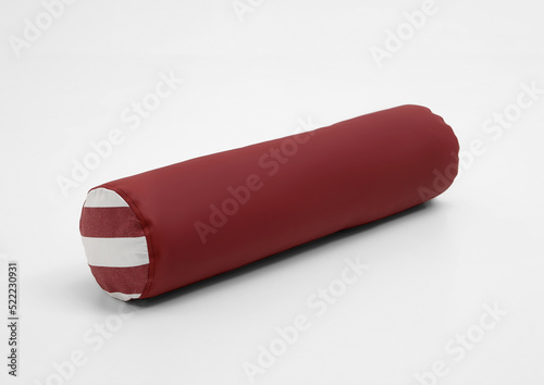 Red cylinder pillow , roll pillow. Background white , isolated .