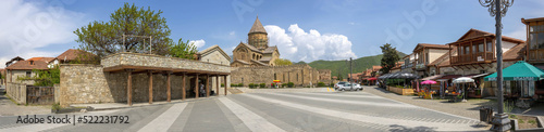 Svetitskhoveli Cathedral and a square nearby with restaurants, Mtskheta, Georgia photo