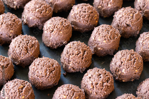 Sweet cocoa cookies. Freshly baked cocoa cookies in a tray. close up © enezselvi