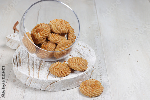 Kukis semprit speculos or biscoff butter cookies, made from butter, egg, flour, speculoos jam, sugar and biscuits crumble. photo