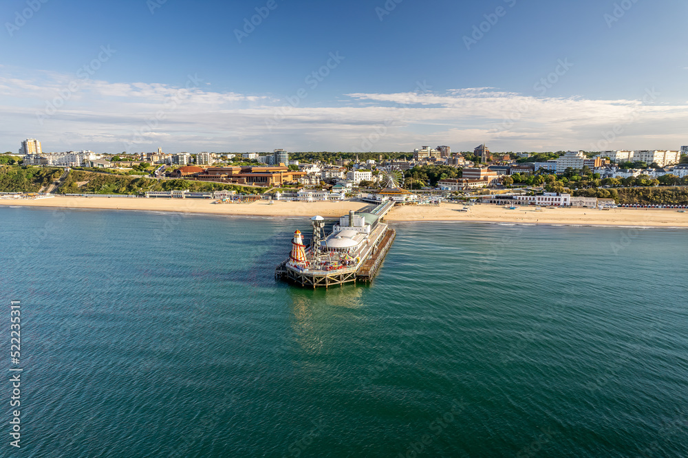 The drone aerial view of the Bournemouth beach, Observation Wheel and Pier. Bournemouth is a coastal resort town in the Bournemouth, Christchurch and Poole council area of Dorset, England. The drone aerial view of the Bournemouth beach, Observation Wheel and Pier. Bournemouth is a coastal resort town in the Bournemouth, Christchurch and Poole council area of Dorset, England.
