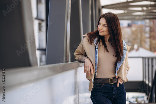 Young woman in casual wear posing in the street