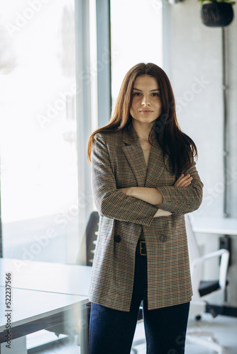 Portrait of young business woman in office Free Download Portrait of young business woman in office - GFXLoad