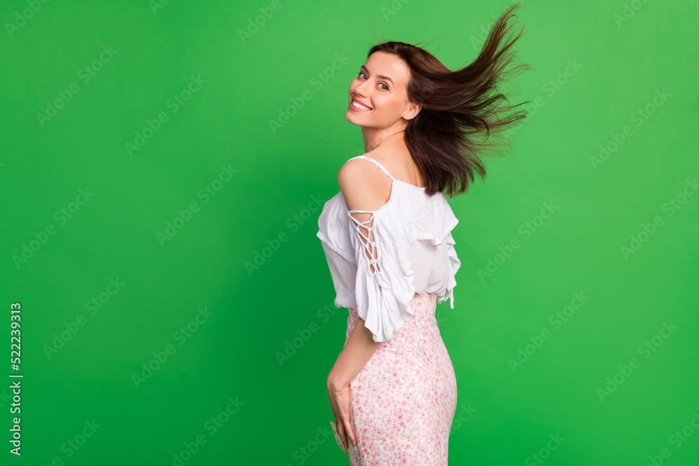Profile photo of positive lovely girl toothy smile flying hairstyle isolated on green color background Profile photo of positive lovely girl toothy smile flying hairstyle isolated on green color background