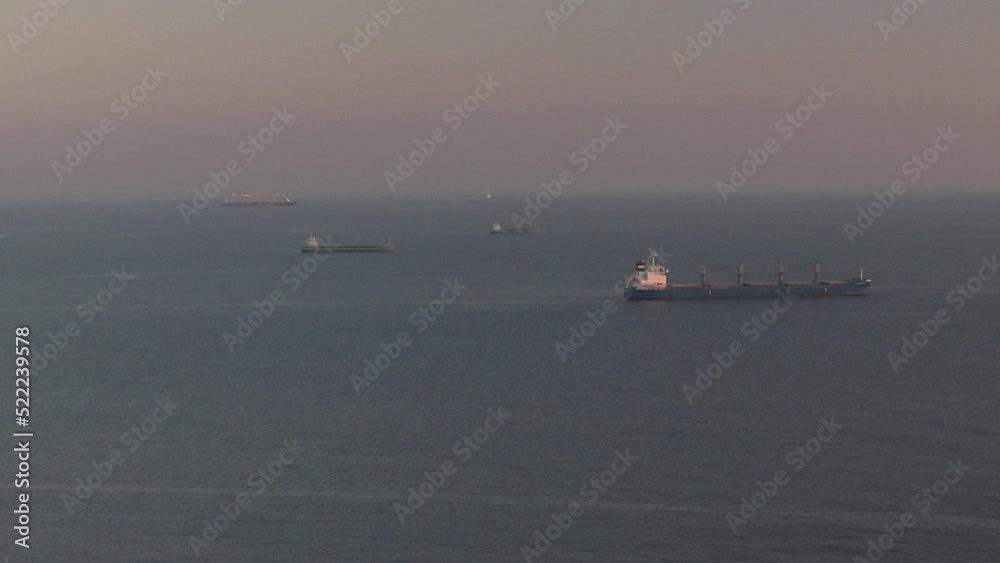Aerial drone video of commerical tanker and cargo ships at the distance near Lisbon, Portugal Aerial drone video of commerical tanker and cargo ships at the distance near Lisbon, Portugal