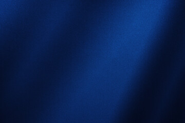 Abstract dark blue background. Silk satin. Navy blue color. Elegant background with space for design. Soft wavy folds.