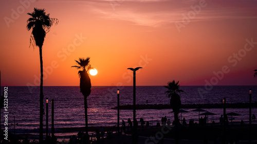 sunset on tel aviv beach in the summer photo