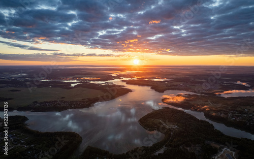 Sunrise among the clouds over a lake (aerial drone photo). Istra lake, Russia