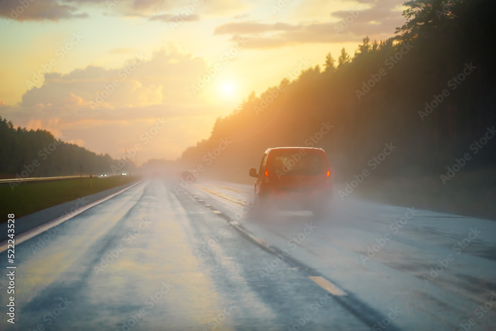 Car going on the road after the rain. Car going on the road after the rain.