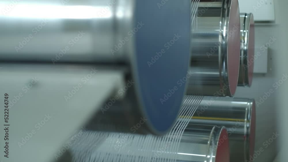 Polymer thread making machine in action Polymer thread making machine in action