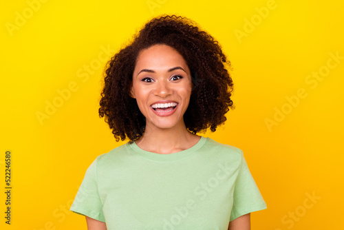 Photo of impressed brunette millennial lady wear green t-shirt isolated on bright yellow color background © deagreez