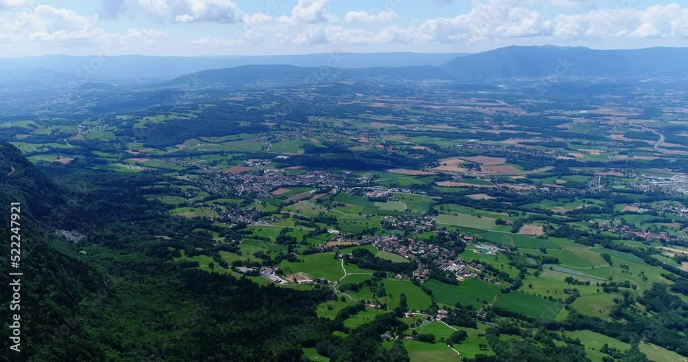 Aerial shot of green countryside, fields, villages, lake and mountain Aerial shot of green countryside, fields, villages, lake and mountain