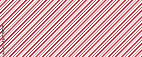 Candy cane seamless pattern. Christmas striped red background. Cute caramel package print. Xmas holiday diagonal lines. Peppermint wrapping texture. Abstract geometric wallpaper. Vector illustration. 