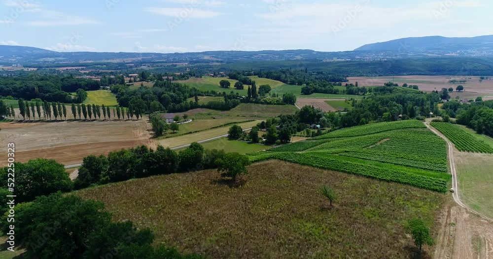 Aerial shot of hilly countryside with various fields and trees Aerial shot of hilly countryside with various fields and trees