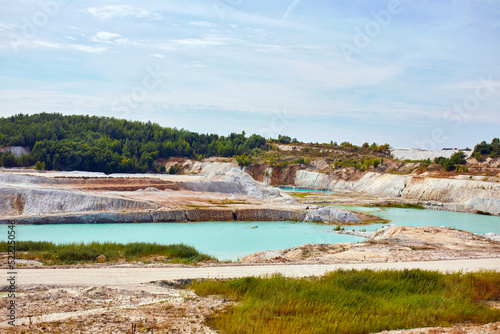Quarry extraction porcelain clay, kaolin, with turquoise water