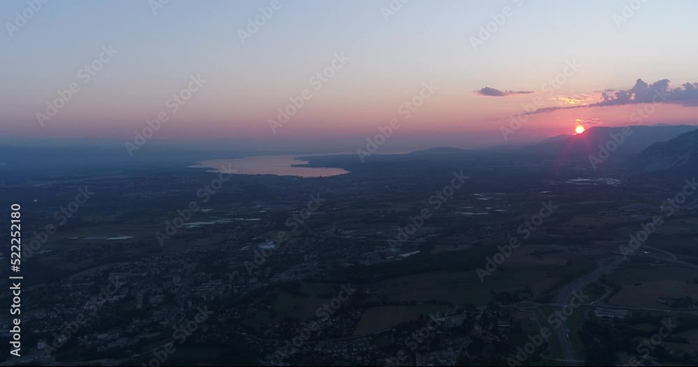 Aerial shot of countryside with mountain sunrise, lake background Aerial shot of countryside with mountain sunrise, lake background
