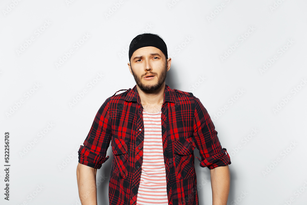 Studio portrait of young man, cool funny guy, on white background. Studio portrait of young man, cool funny guy, on white background.