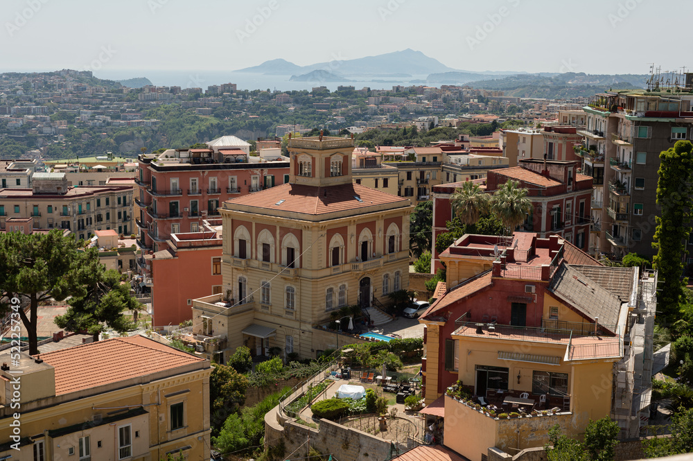 Amazing landscape on the terracotta roofs of Naples from the fortress of Sant Elmo. A charming observation deck with history. Panorama of the city.