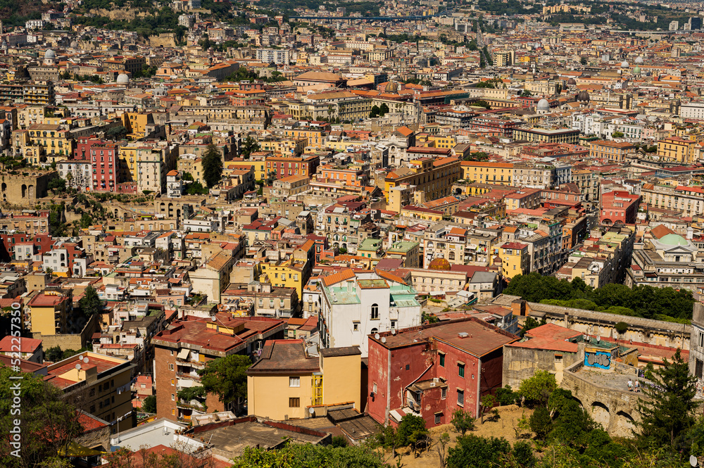 Amazing landscape on the terracotta roofs of Naples from the fortress of Sant Elmo. A charming observation deck with history. Panorama of the city.
