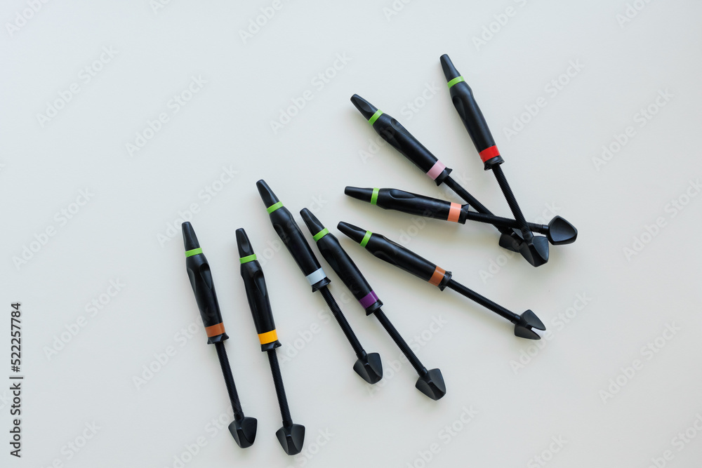 Syringes of dental filling material on white background Syringes of dental filling material on white background
