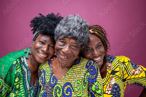 Studio portrait of senior woman with mature daughters