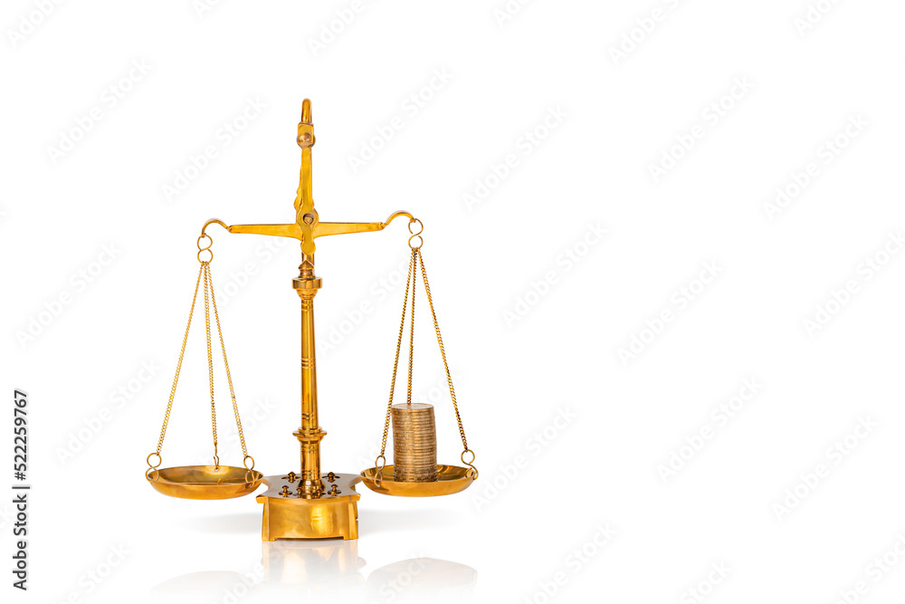Stacked golden coins on weighing scales isolated on white background. Copy space. Stacked golden coins on weighing scales isolated on white background. Copy space.