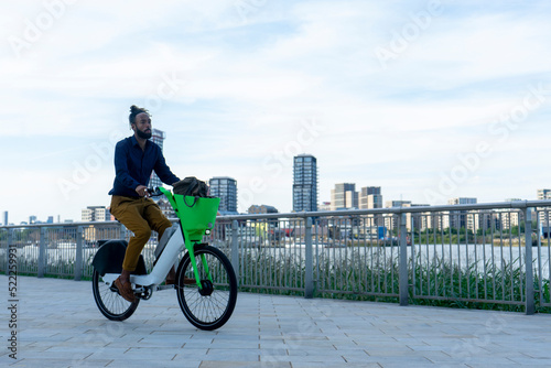 Photography Businessman riding rental bicycle