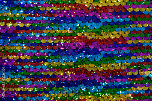 Background sequin. sequin BACKGROUND. glitter surfactant. Holiday abstract glitter background with blinking lights. Fashion fabric glitter.