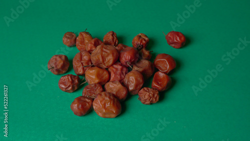 Indian jujube or ber or berry grown in the wild or jungle. Closeup of India fruit on beautiful background. photo