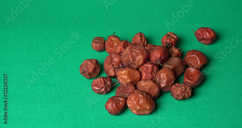 Indian jujube or ber or berry grown in the wild or jungle. Closeup of India fruit on beautiful background. photo