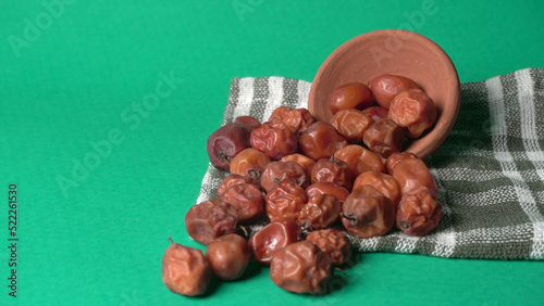 Indian jujube or ber or berry grown in the wild or jungle. Closeup of India fruit on beautiful background.