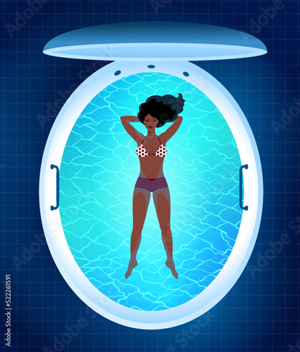 Young woman resting in floating tank capsule