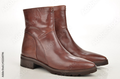 Brown leather boots isolated on white.
