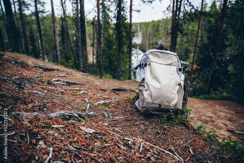 Tourist Backpack of hiker on ground in fall forest in Finland