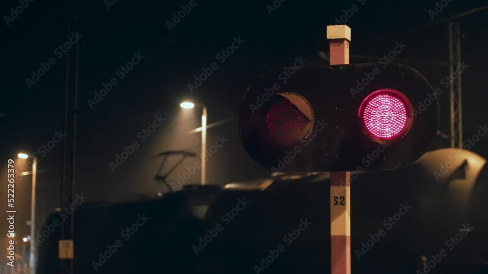 Loaded freight train passing by railway crossing